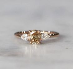 an engagement ring with three diamonds on it