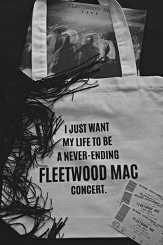 a white bag with black writing on it and an image of a woman's face