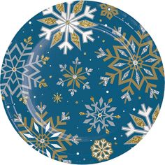 a paper plate with gold and white snowflakes on it