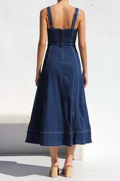 Comfy Denim Maxi Dress Maxi dress with front buttons, pockets and shoulder straps. It has a shaped bodice with sweetheart neckline. Sleeveless. 65% cotton, 35% polyester Small Bust: 30" Length: 46" Medium Bust: 32" Length: 47" Large Bust: 34" Length: 48" X-Large Bust: 36" Length: 49" Suspenders Casual, Button Midi Dress, Denim Suspenders, Denim Maxi Dress, Flattering Dress, Short Coat Jackets, Swimsuit Dress, Flattering Dresses, Crown Hairstyles