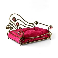 a pink dog bed with metal frame and foot rest