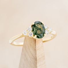 "RHEA" - OVAL MOSS AGATE ENGAGEMENT RING WITH DIAMOND ACCENTS Moss Agate Engagement Ring, Staghead Designs, Oval Cut Engagement Ring, Agate Engagement Ring, Mens Engagement, Oval Engagement, Ring With Diamond, Detailed Ring, Montana Sapphire