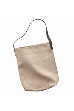 This everyday bag bag is made of thick, coarse linen fabric with an inner pocket for storing your phone and a base gusset that fits a pouch or a bag of snacks. Despite its slim profile, it can fit an A4-size notebook vertically, making it ideal as a bag for everyday use. The singular handle is made with brown leather and features hand-sewn accent side stitching. It hangs elegantly on the crook of your elbow or below the arm as a shoulder bag. Specifications: A natural beige colorway Made from 10 Brown Linen Bag For Everyday Use, Everyday Satchel Bag With Flat Pocket, Beige Tote Shoulder Bag With Flat Pocket, Beige Bags With Flat Pocket For Everyday Use, Beige Everyday Bags With Flat Pocket, Brown Linen Shoulder Bag For Daily Use, Beige Canvas Pouch Bucket Bag, Natural Linen Shoulder Bag For Everyday Use, Eco-friendly Shoulder Bag With Canvas Lining For Everyday Use