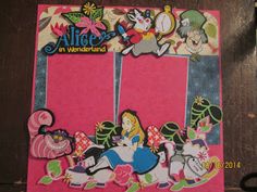 an alice in wonderland cutout is shown on a piece of paper with scissors next to it