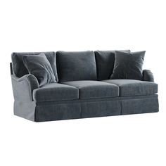 a gray couch with four pillows on it