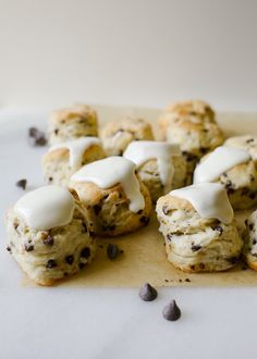 chocolate chip cookies with white icing on top