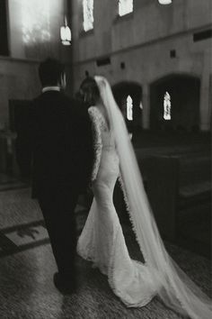 the bride and groom are walking down the aisle