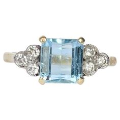 an aqua blue topazte and diamond ring