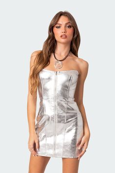 Mini dress Strapless fit Zip front closure Metallic fabric Faux Leather Model wears size S Model height is 5'8 Item care: Hand wash Modern Corset, Metallic Mini Dress, Visionary Fashion, Basic Black Dress, Neon Outfits, Spring Maxi Dress, Metallic Mini Dresses, Silver Party, Leather Corset