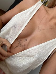 a woman with a tattoo on her chest