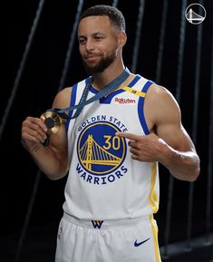 the golden state warriors basketball player is holding his trophy