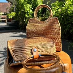 This versatile rattan handbag features a unique top handle design, making it perfect for any occasion. Free Shipping on all rattan bags with handles. Crafted from Ata Grass sourced from Indonesia. Each item is handmade in a small industry in Bali, Indonesia. Smoking method used to achieve a natural golden brown color; a slight smoke scent may be present upon arrival but will dissipate over time. 100% Handmade, with possible slight variations in size and color. Dimensions: Medium: 22.5 cm x 8.5 cm x 21.3 cm (8.8" x 3.3" x 8.3") – excluding circle handle. Top Handle: 11.5 cm (4.5"). Batik Lining inside, with each bag featuring unique patterns and colors. Production time: Approximately seven to ten business days per order. The intricate weaving paired with a vibrant fabric lining adds a touch Metallic Cowhide Rug, Rattan Bags, Golden Brown Color, Circle Handle, Rattan Handbags, Fur Jacket Women, Patchwork Cowhide Rug, Brindle Cowhide, Rattan Weave