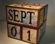 a close up of a wooden block with the word sep 1 on it's side