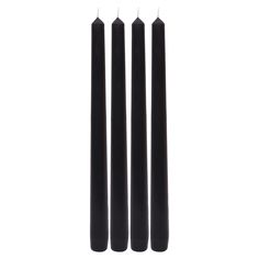 three black candles sitting next to each other