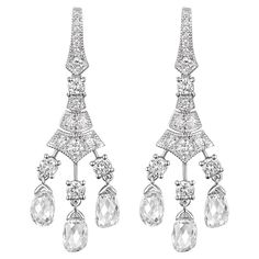 Step back in time with the elegance and allure of our antique briolette diamond dangle earrings. Delicately handcrafted in 18 karat white gold, these earrings exhibit a masterful blend of vintage design and modern craftsmanship. Each earring gracefully cascades with three meticulously cut briolette diamonds, artfully suspended to capture and amplify light with every subtle movement. In total, the briolette diamonds weigh an exceptional 3.22 carats. Enhancing their brilliance and lending a lumino Briolette Diamond, Round Diamond Setting, Diamond Dangle Earrings, Step Back, Cut Loose, Rose Cut Diamond, Back In Time, Design Vintage, Rose Cut