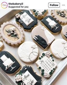 decorated cookies are arranged on a tray