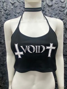 This is a black Void cropped halter top with tie back strings on the neck. They're very long so you can wrap them around the neck for a collared look or just tie back. Scroll thru the photos for different ways of wearing. This has a Void logo image screen printed on the front. 95% Cotton/ 5% Spandex These are handmade screen-printed and may slightly vary from the photo. Please feel free to email me any questions. Thanks for looking. Due to an influx of incorrect addresses if a package is returne Black Cropped Halter Top For Summer, Punk Style Crop Top For Festival, Black Crop Top For Summer Concerts, Y2k Halter Neck Top For Night Out, Black Halter Neck Top For Festival, Alternative Style Black Crop Top For Festival, Trendy Cropped Halter Top For Club, Alternative Style Halloween Party Crop Top, Black Stretch Crop Top For Concert