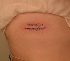 a woman's stomach with the words perfectly imperfect written on her back side ribcage