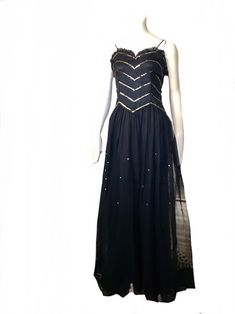 "this is an amazing vintage 1930s 40s art deco formal glamour evening cocktail party gown  this spectacular dress features a fitted bodice,  sleeveless with black shoulder straps. a long flowing net sheer skirt with underskirt. the bodice is adorned with beautiful sparkly gold sequins in a striped pattern and the front of the skirt has the same gold sequins scattered around on the middle section. the neckline is adorned with cute black ruffle trim. hook and eye closures on the side bodice this d Party Evening Dress With Fitted Bodice And Empire Waist, Fitted Bodice Evening Dress With Empire Waist, Art Deco Fitted Sequin Dress, Empire Waist Prom Season Evening Dress, Evening Gown With Fitted Bodice And Empire Waist, Fitted Empire Waist Evening Dress, Evening Maxi Dress With Lined Bodice And Empire Waist, Evening Maxi Dress With Empire Waist, Fitted Empire Waist Maxi Dress For Prom