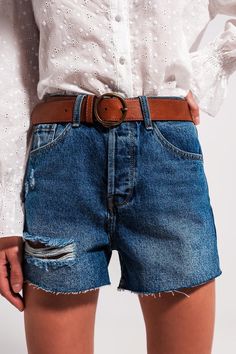 Comfy, chic, and cute, these high-waisted distressed denim shorts in mid wash boast of a cropped length, five pockets, belt loops, a zip fastening, frayed ends, and a stretchy fabric that is made from 98% Cotton and 2% Elastane. There are countless ways to style these shorts, making them the perfect go-to bottoms in the warmer months. The model is 5’9” with measurements of 32-23-35 and is wearing a size small. The XS-S-M-L-XL sizing equates to US sizes of 2, 4, 4, 6, and 8 respectively. Mens Lightweight Jacket, Men Parka, Types Of Jeans, Ripped Denim Shorts, Mens Slides, Denim Jacket Men, Ripped Denim, Distressed Denim Shorts, High Waisted Shorts Denim