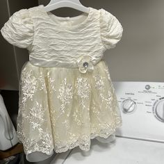 Brand New Dress , Bought For My Baby And She Never Got To Wear It Cute Short Sleeve Baptism Dress For Party, Short Sleeve Fitted Baptism Dress, Cream Short Sleeve Fitted Baptism Dress, Cute Cream Dress For First Birthday, Cream Baptism Dress With Short Sleeves, Cream Short Sleeve Baptism Dress, Fitted Cream Dress For First Birthday, Elegant Cream Dress For First Birthday, Cute Short Sleeve Baptism Dress