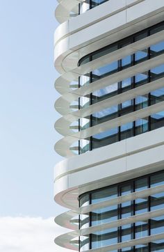 a tall white building with lots of windows