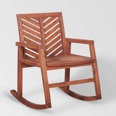 a wooden rocking chair on a white background