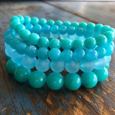 We offer free standard shipping for orders over $40 within the US. The perfect mix of aqua blue tones collide in this set of turquoise hues made with vintage beads. Bead Color Bracelets, Bead Sizes, Surgical Steel Earrings, Bracelets Set, Arm Party, Vintage Beads, Vintage Lucite, Aqua Color, Colorful Bracelets