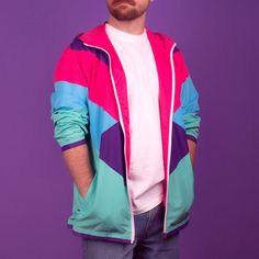 Travel back to the 1980's with this pink, purple, teal, and blue windbreaker. This lightweight windbreaker ensures maximum comfort on windy, rainy, and sunny days, thanks to the water-resistant fabric and breathable mesh lining. The windbreaker has an effortless look that will fit different styles and can be easily layered with long and short sleeve shirts.  * 100% polyester * Fabric weight: 2.21 oz/yd² (75 g/m²) * Lightweight, water-resistant fabric * Breathable mesh lining, reduces static * Regular fit * Elastic cuffs * Hood and side pockets * Zippable front * Blank product sourced from China Pink Retro Windbreaker For Streetwear, Retro Pink Windbreaker For Streetwear, Retro Pink Hooded Windbreaker, Pink Retro Hooded Windbreaker, 90s Pink Windbreaker For Streetwear, Retro Pink Windbreaker, 90s Style Multicolor Windbreaker For Spring, 90s Multicolor Hooded Outerwear, 90s Style Pink Windbreaker For Spring