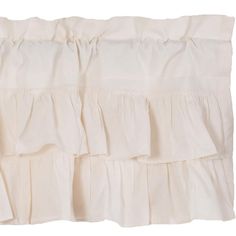 the ruffled bed skirt is made with white linens and has an attached zipper