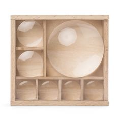 a wooden box filled with different sized and shaped objects