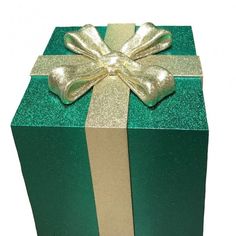 a green gift box with a gold bow