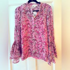 So Pretty! This Kors “Enchanted Bloom Top” In Hibiscus Features An All Over Floral Design Button Closure And Flared Sleeves. It’s A 2 For 1! Wear It With Jeans Or A Skirt! Pink Camisole Attaches With Snap But Can Be Worn Alone Too! The Sleeves And Detail Is Gorgeous! This Flouncy Sexy Girly Blouse And Cami Will Steal The Show! Michael Kors M Nwt Pink Floral Print Chiffon Tops, Pink V-neck Blouse With Blouson Sleeves, Pink Blouson Sleeves V-neck Blouse, Long Sleeve Georgette Blouse, Pink Chiffon Blouse For Fall, Elegant Floral Print Georgette Blouse, Flowy Pink Chiffon Blouse, Elegant Georgette Blouse With Floral Print, Pink Georgette Blouse For Summer