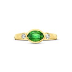 This Oval Emerald Bezel Diamond Ring showcases an oval cut emerald in a bezel setting, flanked by a brilliant round diamond on each side. Emerald Bezel Set Oval Cabochon Ring, Green Emerald Ring With Oval Cabochon Bezel Setting, Oval Emerald Ring With Bezel Setting, Oval Tsavorite Diamond Ring For Formal Occasions, Timeless Oval Emerald Ring With Bezel Setting, Oval Green Ring With Bezel Setting, Green Oval Ring With Bezel Setting, Brilliant Cut Oval Diamond Ring With Tsavorite, Classic Emerald Ring With Bezel Setting, Oval Cabochon