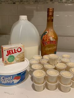 the ingredients to make an ice cream dessert are displayed on a counter top next to a bottle of jello