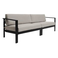 a black and white couch sitting on top of a wooden frame