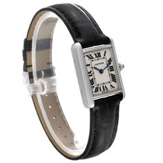 Cartier Tank Louis White Gold Black Strap Ladies Watch W1541056. Quartz movement. 18K white gold case 22 mm x 29 mm. Circular grained crown set with a blue sapphire cabochon. . Scratch resistant mineral crystal. Silver grained dial with black Roman numerals. Blued steel sword shaped hands. Black leather strap with 18K white gold tang buckle. Classic Cartier Watch Band For Formal Occasions, Classic White Gold Everyday Luxury Watch, Cartier Analog Watch In White Gold, Cartier White Gold Analog Watch, Cartier Timeless Formal Jewelry And Watches, Classic Diamond Watch With Rectangular Dial, Cartier Timeless Jewelry And Watches For Formal Occasions, Timeless Cartier Jewelry And Watches For Formal Occasions, Timeless Analog Jewelry Watches For Formal Occasions