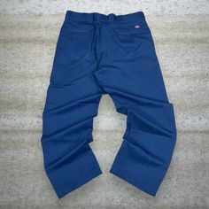 Vintage Dickies Khakis Pants Navy Blue Relaxed Fit Flat Front Work Wear 90s Skate / Streetwear Great Condition: 7/10 (small marks, aka some character) Men's Size:  Waist: 36" Length (inseam): 30" Leg Opening: 9" Thigh Opening: 13" Front Rise: 13" 90s Style Denim Blue Cotton Bottoms, 90s Denim Blue Cotton Bottoms, 90s Style Cotton Cargo Pants, 90s Denim Blue Pants With Pockets, 90s Style Full-length Cotton Bottoms, 90s Style Full Length Cotton Bottoms, Retro Blue Bottoms For Streetwear, 90s Style Denim Blue Cotton Pants, Relaxed Fit Blue Cargo Pants With Belt Loops