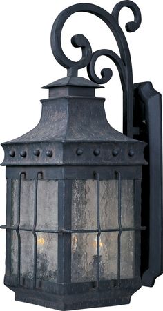 an old - fashioned light fixture is shown against a white background, with intricate iron work