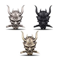 three different types of masks with horns on them