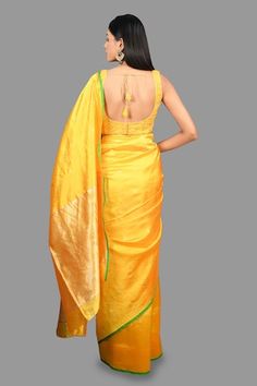 Canary yellow banarasi handloom saree crafted in pure chanderi silk with bloom buta woven details and contrasting green border detailing. Comes with an unstitched blouse piece. - Aza Fashions Yellow Handloom Blouse Piece For Wedding, Fitted Yellow Banarasi Silk Traditional Wear, Yellow Tissue Silk Saree With Zari Weaving, Yellow Handloom Tissue Silk Blouse Piece, Yellow Pre-draped Saree With Zari Weaving In Tissue Silk, Fitted Yellow Dupatta With Zari Weaving, Yellow Tissue Silk Pre-draped Saree With Zari Weaving, Fitted Yellow Traditional Wear With Zari Weaving, Fitted Yellow Handloom Traditional Wear