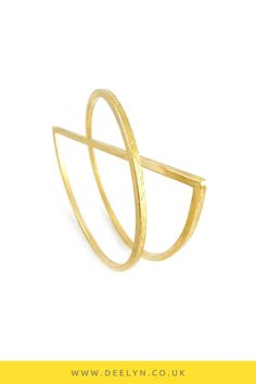 Gold plated statement bangle from the Entrapment collection - architectural and geometric sculptural statement art jewellery by @deelyndesign - it's wearable art inspired by modern, contemporary architecture. Handmade in the UK by artist Deelyn Walsh. Statement Jewelry