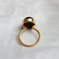 D E T A I L S - Material: 925 Sterling Silver Stone: Black Onyx Stone Shape: Square The fit: True to US ring size Finish: Smooth and gold plated to a high shine S H I P P I N G & P R O D U C T I O N - My current production time is 2-6 business days, which means after those days are up, your order ships! I make everything custom to order, by hand, but I promise you it's worth the wait! R U S H - M Y - O R D E R - If you're in a rush to get your pretty new pieces, please send me a message and Classic Adjustable Black Enamel Rings, Black Oval Opal Ring For Formal Occasions, Minimalist Ring With Black Enamel, Oval Onyx Wedding Ring, Minimalist Black Enamel Rings, Black Round Rings With Bezel Setting, Black Round Ring With Bezel Setting, Black Oval Cabochon Opal Ring, Oval Black Enamel Rings For Anniversary