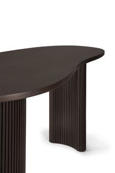 an oval shaped table with two columns on the top and one column at the base