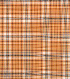 an orange and white plaid fabric with small squares on the front, as well as some black