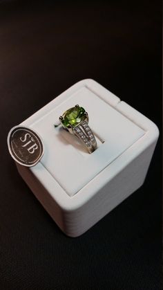 "Oval Peridot and Diamond Ring. This Genuine Peridot measures approximately 9x11 millimeters, set in 14kt White Gold split-shank band with .25ct White Diamond total weight. Clean Classic lines make this a must for any Collection. **Ring size: small 7 **August Birthstone. Pantone Green 2017 color of the year. **This item can be sized up or down 2 sizes for an additional $35.00 Please feel free to contact me anytime, if you have any questions or need any additional information. All items are avail Peridot Round Birthstone Ring For Formal Occasions, Formal Lime Green Rings With Center Stone, Fine Jewelry Diamond Ring With Peridot, Oval Green Diamond Ring With Vs Clarity, Peridot Rings With Accent Stones For Anniversary, Green Rings With Accent Stones, Green Rings With Brilliant Cut Round Stone, Anniversary Peridot Rings With Accent Stones, Fine Jewelry Peridot Ring