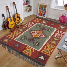 an area rug with guitars on the floor