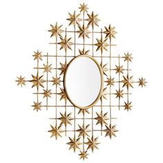 a mirror that is sitting on top of a wall with gold stars around the edges