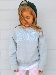 Dress your Little One trendy with this cute Kids Beach Bum Sweatshirt! This comfy Preppy Kids Sweatshirt is sure to become a new favorite! Toddler Sweatshirts also available! SHIPS FREE! SIZING TIPS: Choose your child's "usual size" for a "Relaxed Fit" (not Oversized). If you prefer an "Oversized Look", size up 2 sizes from your child's usual size. If you are not sure what size to choose, lay your child's favorite fitting Sweatshirt flat and measure armpit to armpit and compare the width against Casual Spring Sweatshirt For Playwear, Casual Relaxed Fit Sweatshirt For Playwear, Cotton Tops For Beach Season Playwear, Casual Graphic Print Sweatshirt For Playwear, Blue Cotton Sweatshirt For Vacation, Casual Tops For Beach Season Playwear, Casual Blue Sweatshirt For Beach Season, Beachy Sweatshirt, Tennis Club Sweatshirt