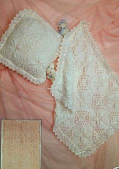 an image of a white crochet baby blanket and teddy bear